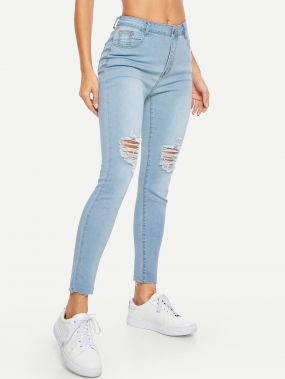 Рваные обтягивающие джинсы с отделкой