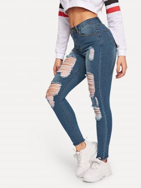 Рваные обтягивающие джинсы с необработанным краем