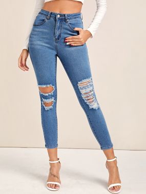 Облегающие рваные джинсы